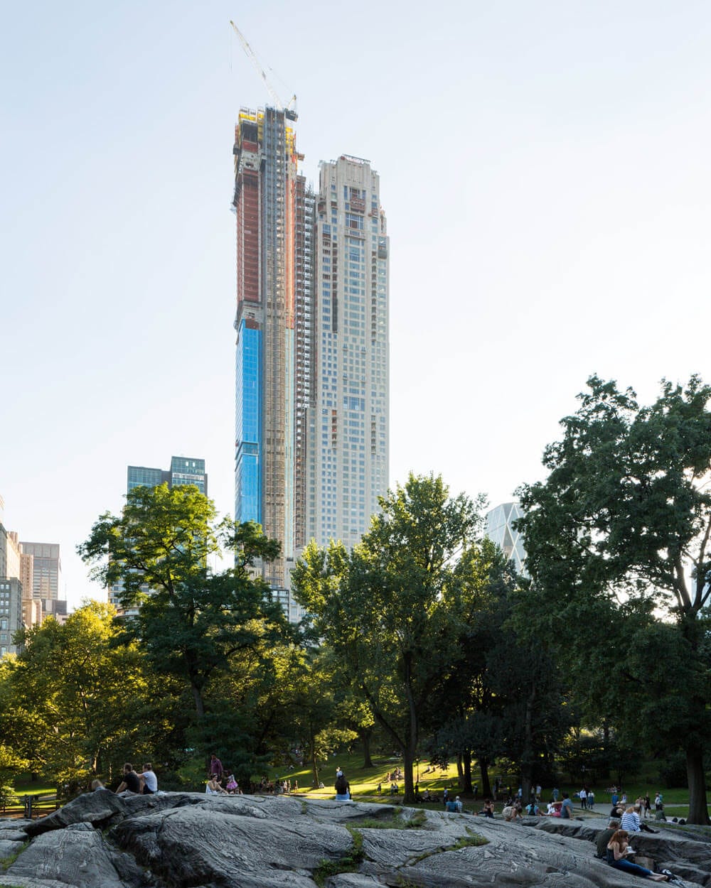 Seen from Central Park: the tower rises with a crane at its peak