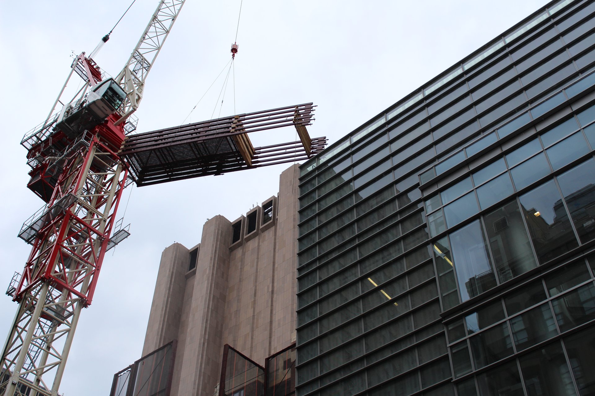 Crane pick of forming material over the site