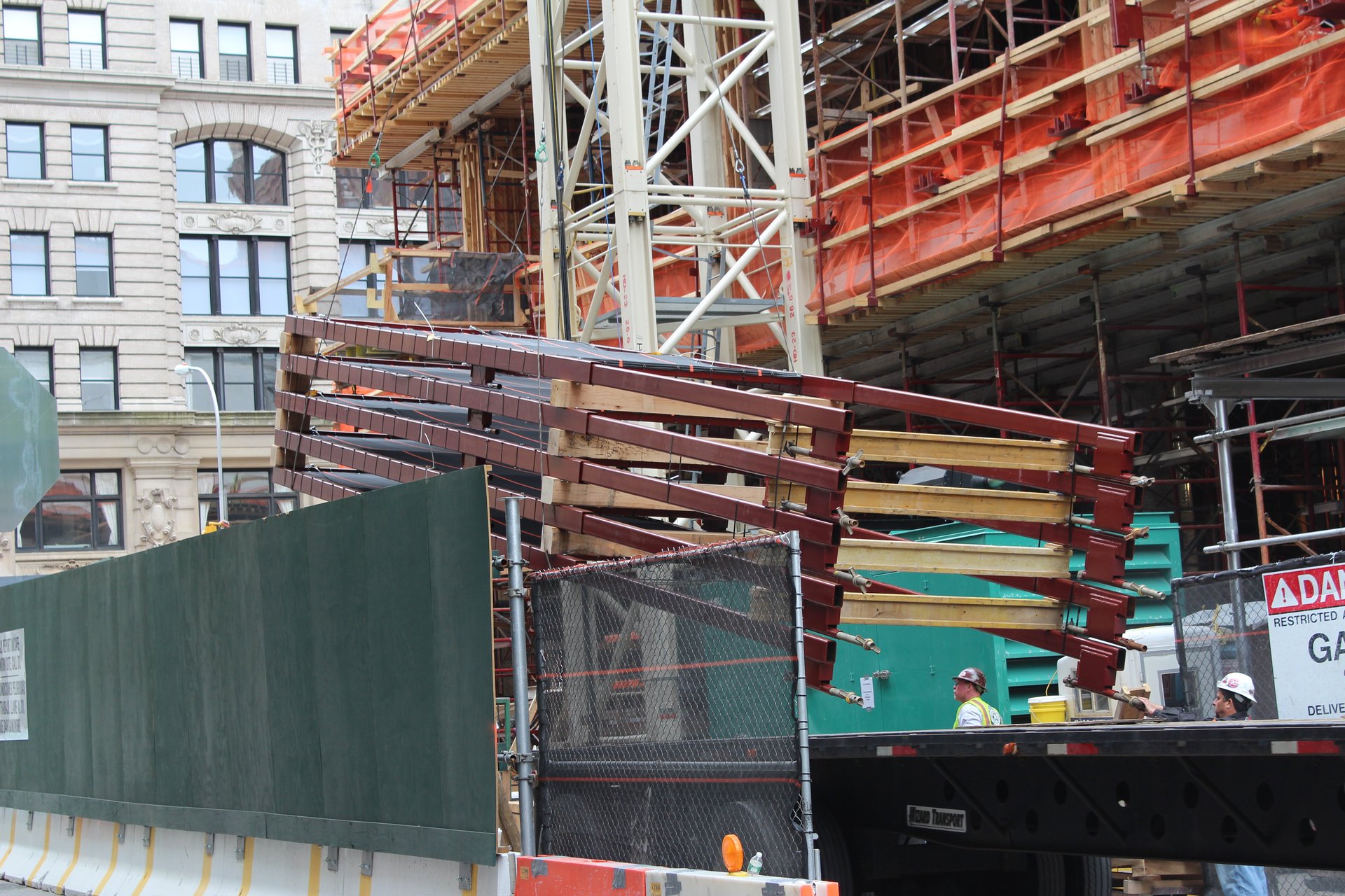 Shoring and forming material staged at the site gate