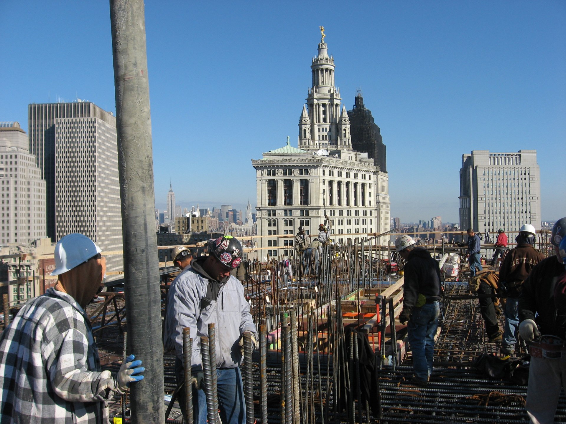 Crews tie deck reinforcement high above Lower Manhattan