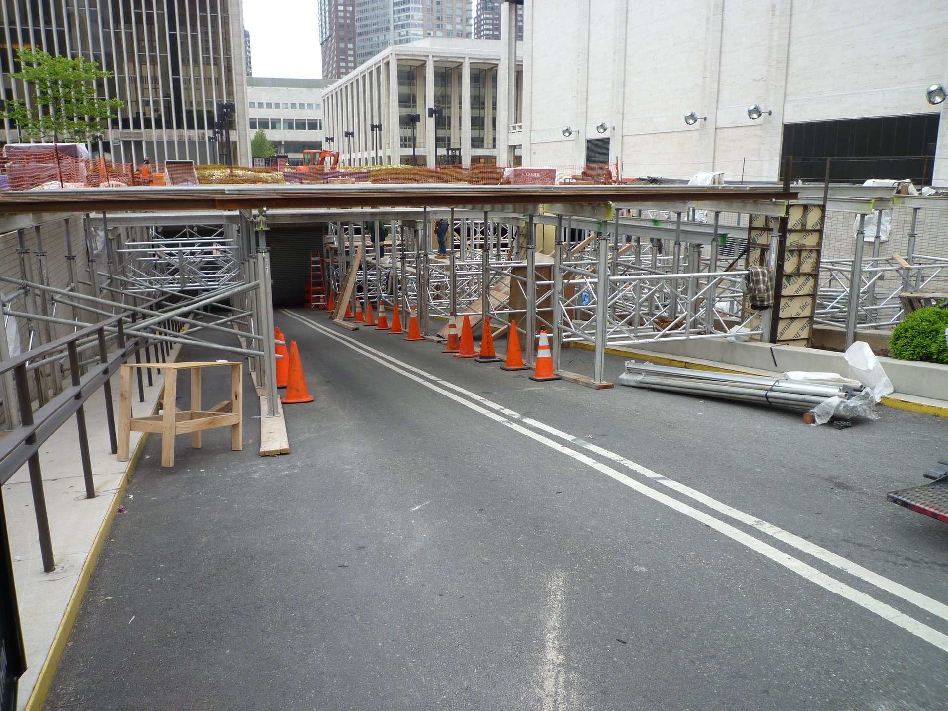 The shored deck carries overhead protection across the roadway