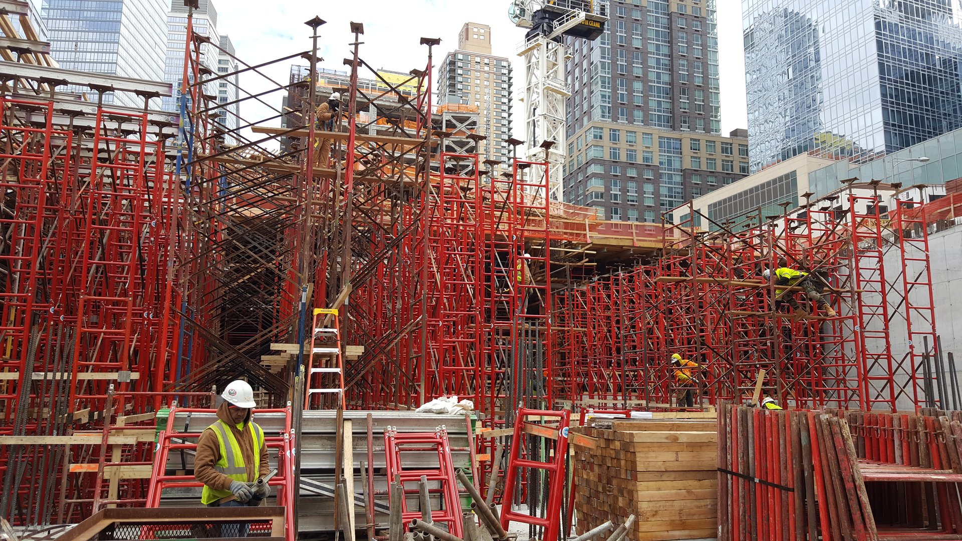 Multi-tier frame shoring towers stepping up the structure