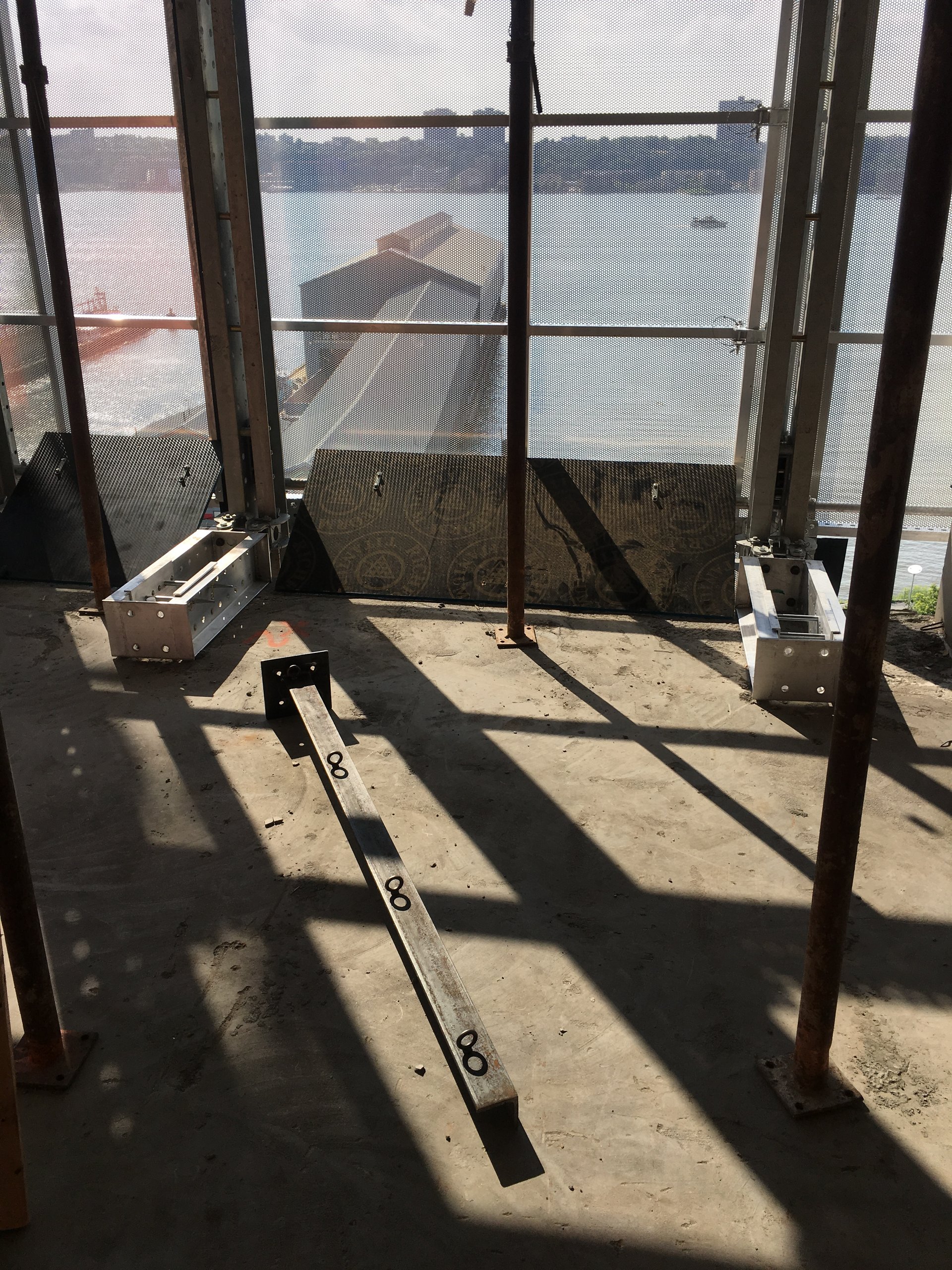 Screen Saver perimeter protection panels at the slab edge, Hudson River beyond