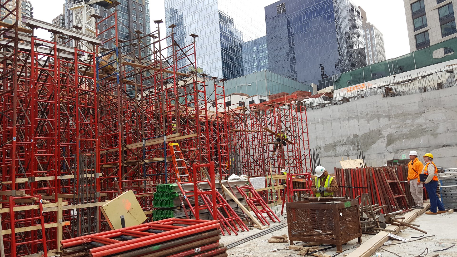Shoring frames and forming material staged on the working deck
