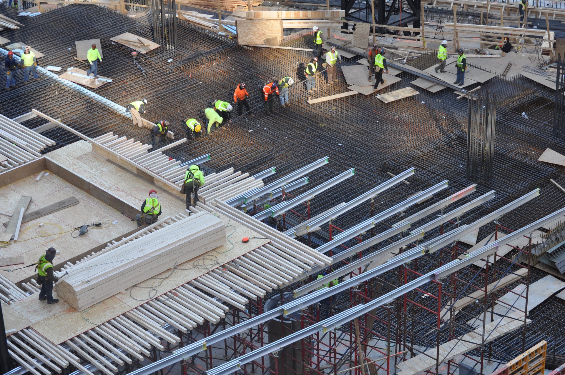 Crews place deck reinforcement over aluminum stringers