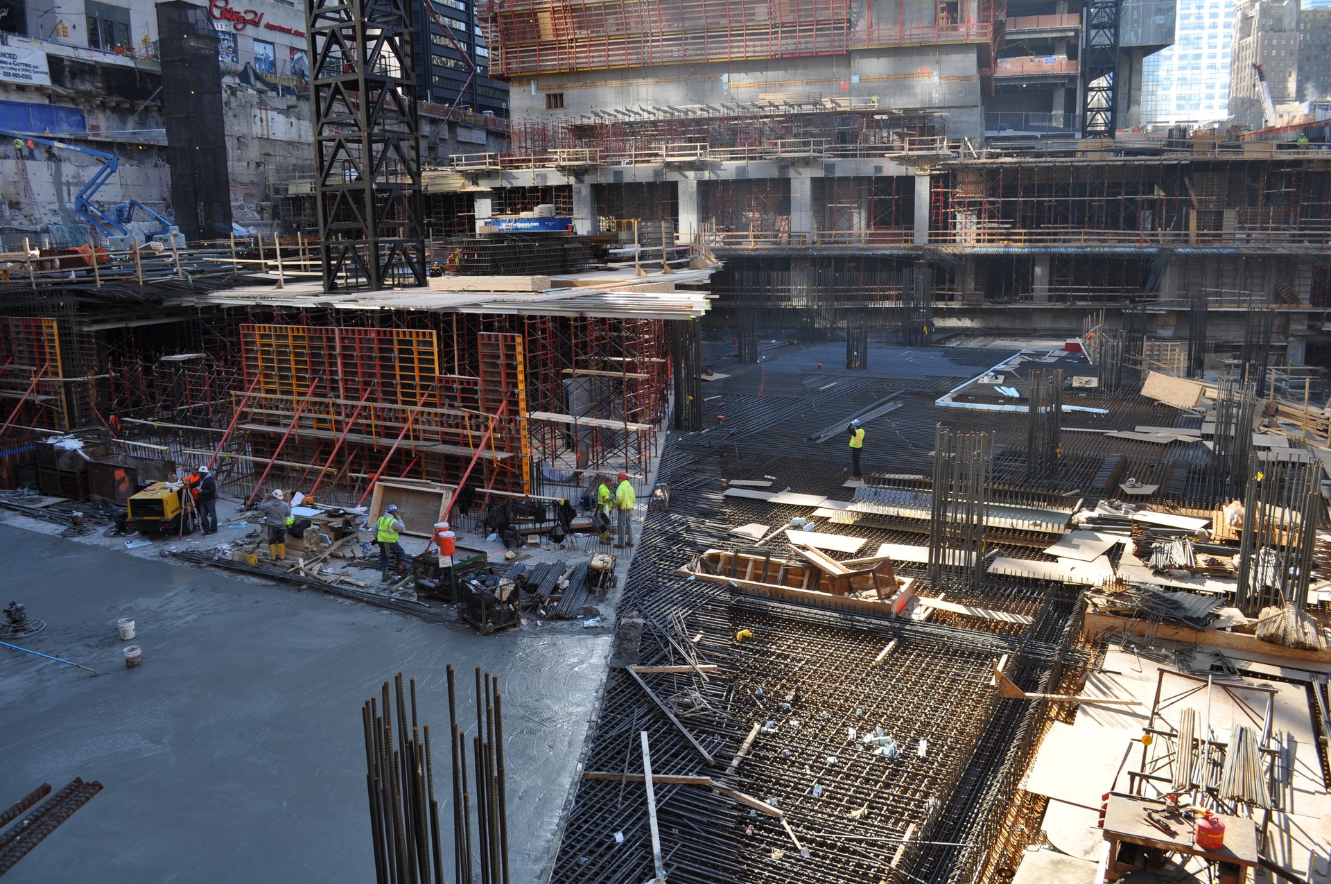 Column reinforcement rises from a freshly placed slab